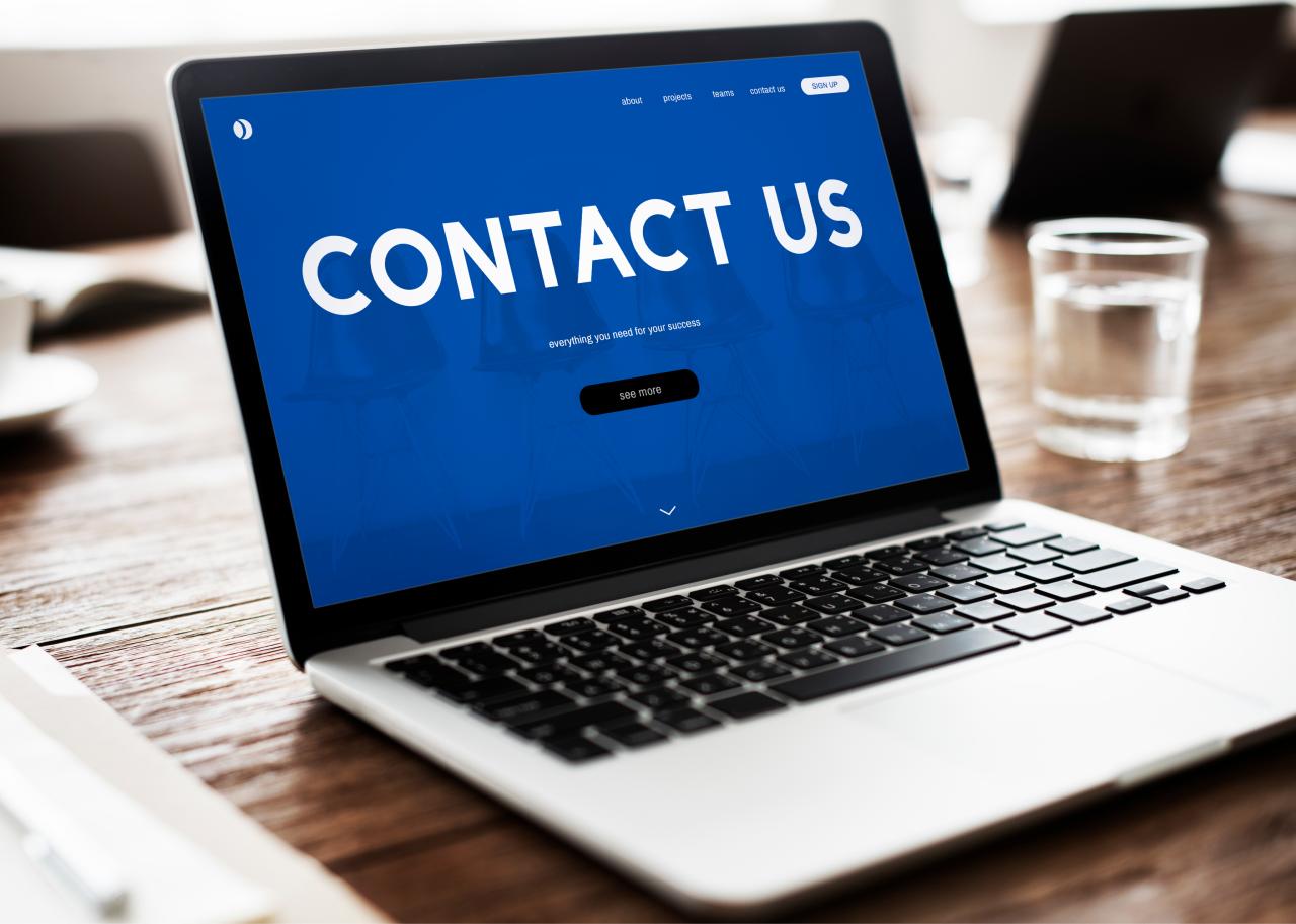 an image of a laptop and contact is writen on its screen